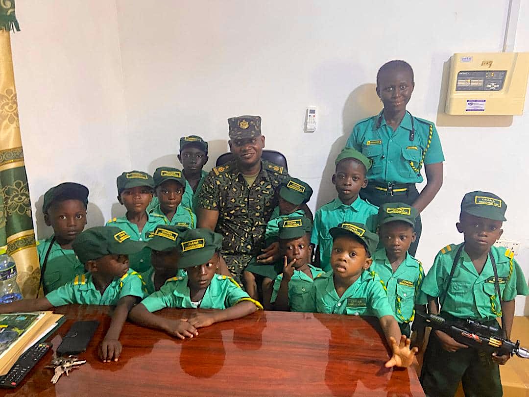 Learners in military costumes with soldiers